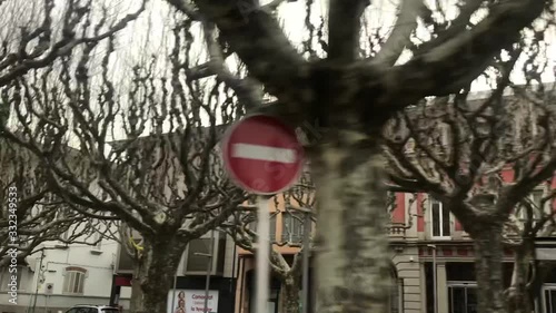 Slow motion shot of unusual barren trees in city street park, Spain photo