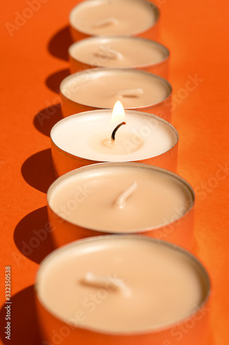 wax candles burn. fire burns. orange background
