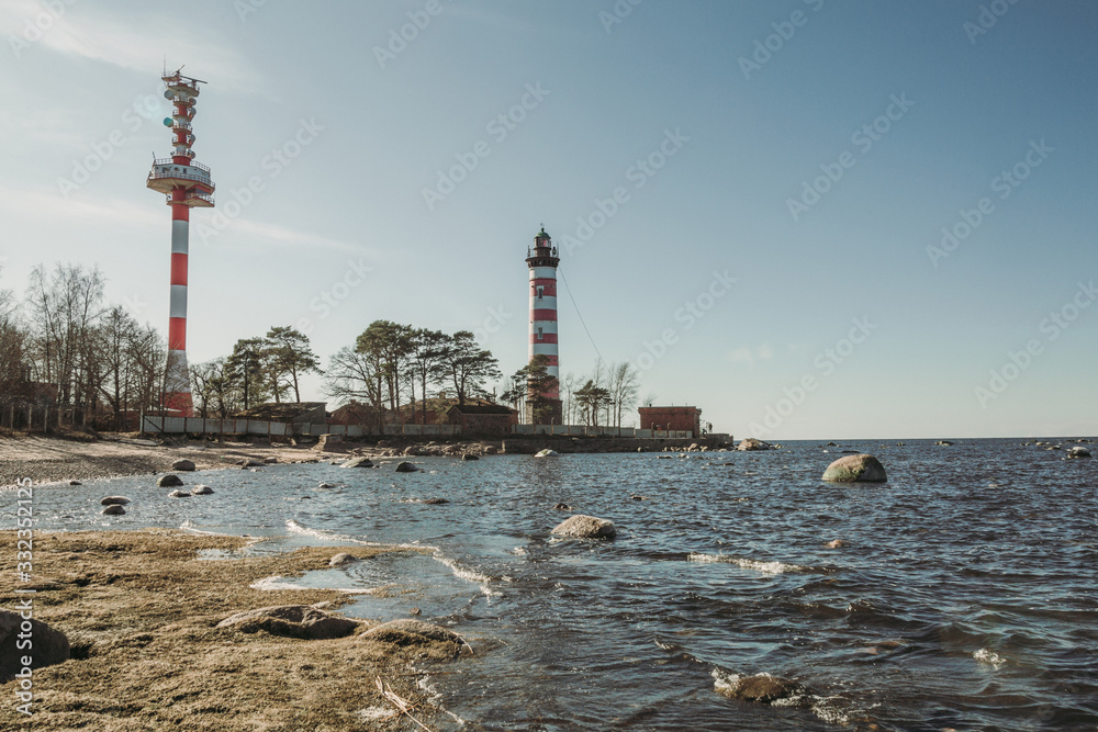 Lighthouse standing on the seashore in spring