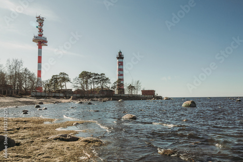Lighthouse standing on the seashore in spring © Daria