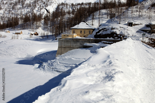Devero Park ( Verbano-Cusio-Ossola ), Italy - January 15, 2017: The Codelago dam in Alpe Devero Park, Ossola Valley, VCO, Piedmont, Italy © PaoloGiovanni