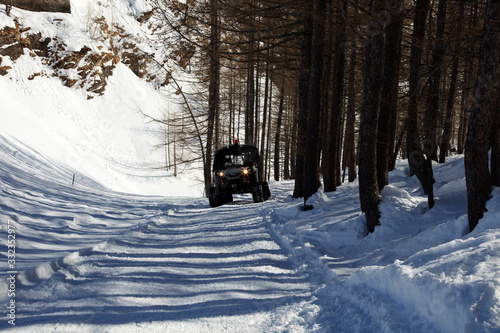 Devero Park ( Verbano-Cusio-Ossola ), Italy - January 15, 2017: A snowcat near Codelago lake in Alpe Devero Park, Ossola Valley, VCO, Piedmont, Italy photo