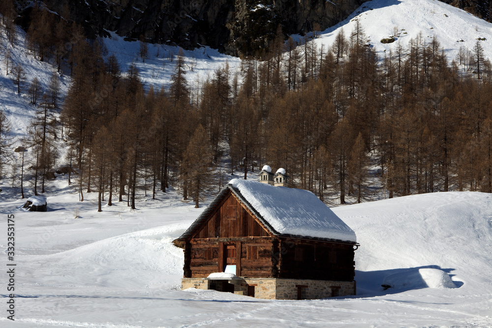 Devero Park ( Verbano-Cusio-Ossola ), Italy - January 15, 2017: Typical house in Alpe Devero Park, Ossola Valley, VCO, Piedmont, Italy