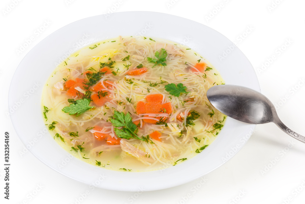 Chicken soup with thin short vermicelli in dish with spoon Chicken soup with thin short vermicelli in dish with spoon