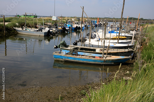 Mesola  FE    Italy - April 30  2017  Fish boats on Po river near Mesola  Delta Regional Park  Emilia Romagna  Italy