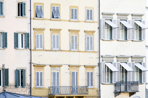 Surface building apartment  with different style of windows in certer city. Vintage background conept. photo