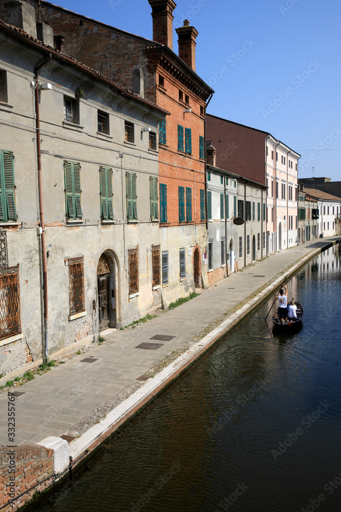 Comacchio (FE),  Italy - April 30, 2017: Houses in Comacchio village near the canal, Delta Regional Park, Emilia Romagna, Italy