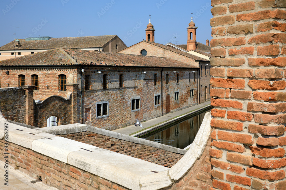 Comacchio (FE),  Italy - April 30, 2017: View of houses and bridge in Comacchio village, Delta Regional Park, Emilia Romagna, Italy