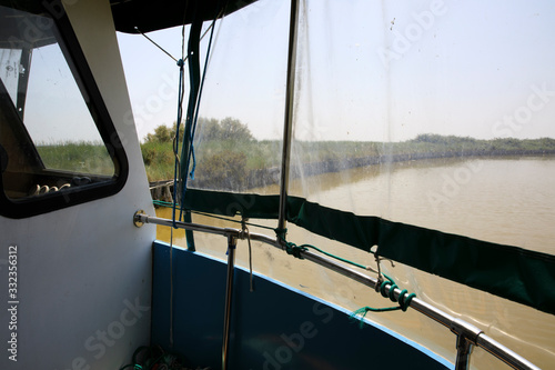 Po river (FE), Italy - April 30, 2017: A canal near the Po river view from a tourist boat, Delta Regional Park, Emilia Romagna, Italy