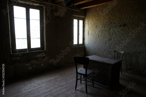 Po river (FE), Italy - April 30, 2017: A old chair and table in a fisherman's houses inside on Po river, Delta Regional Park, Emilia Romagna, Italy