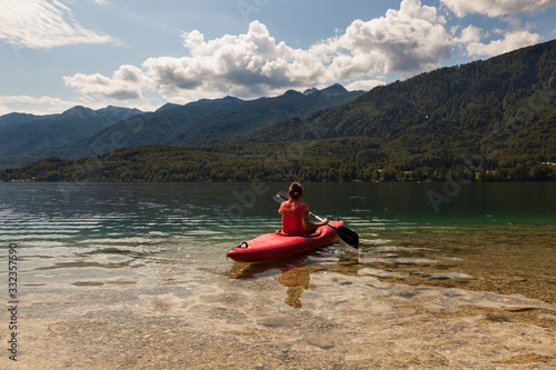 Girl kayaking in the Bohinj lake