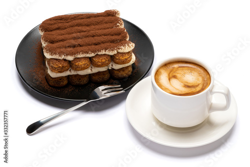 Classic tiramisu dessert on ceramic plate and cup of coffee isolated on white background with clipping path
