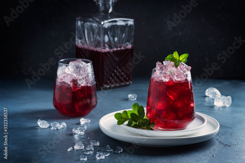 Red cockatil with ice and mint photo