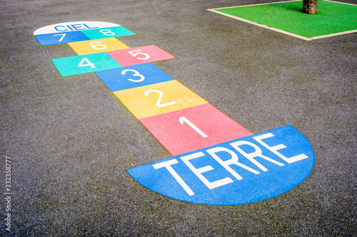 Canvastavla A multicolored hopscotch painted on the asphalted ground of a french schoolyard