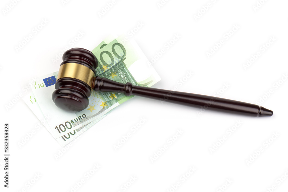 Banknote and judge's hammer with financial concept isolated on white background.