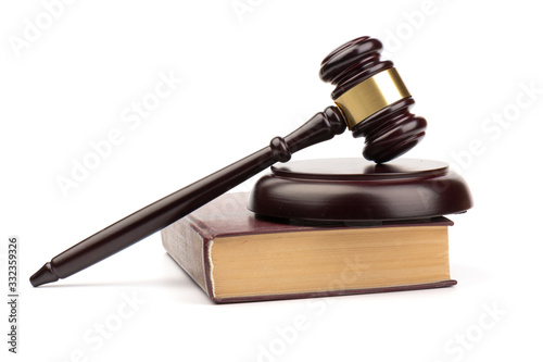 Wooden judges gavel on white background in close up. Space for text
