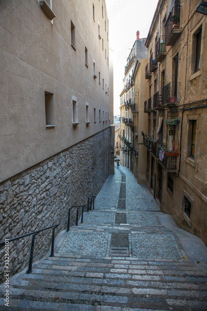 the narrow pedestrian street in a small Spanish town