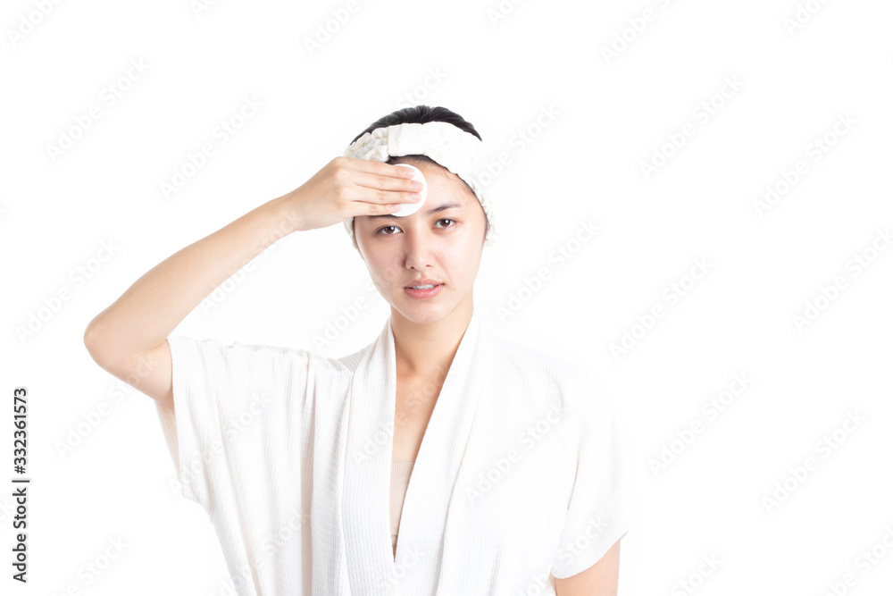 Attractive beautiful natural woman cleaning makeup from her face with cotton pad smile and looking at camera isolated on white background. Skin care and beauty concept. Attractive beautiful natural woman cleaning makeup from her face with cotton pad smile and looking at camera isolated on white background. Skin care and beauty concept.