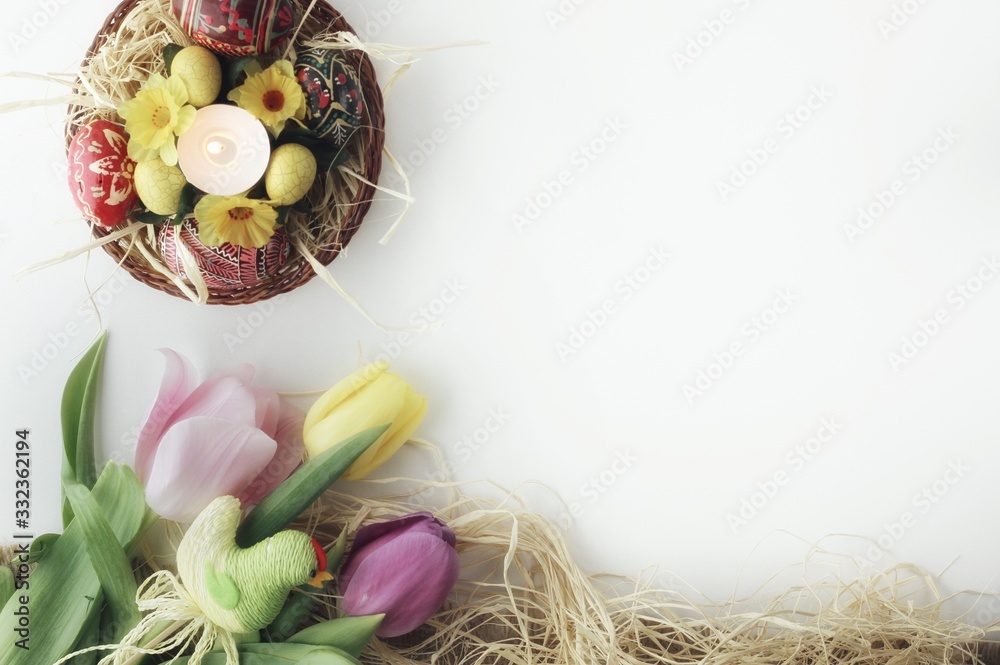 Beautiful Eastern style flat lay with traditional painted eggs and tulips