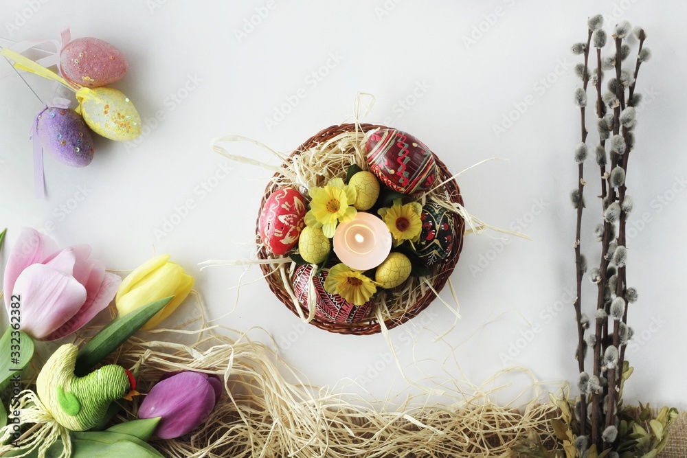 Beautiful Eastern style flat lay with traditional painted eggs and tulips