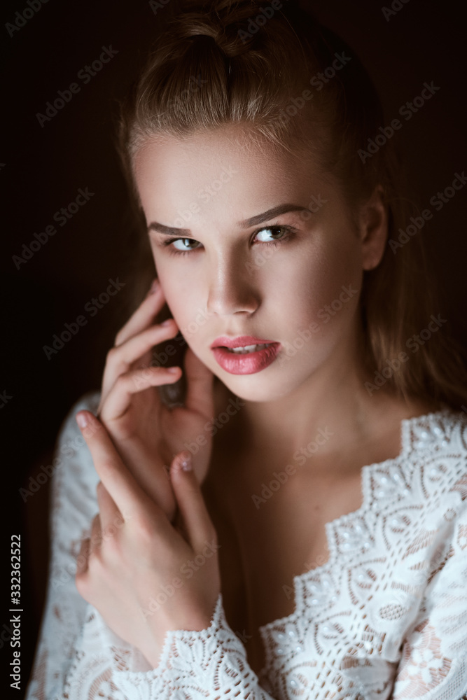 portrait of Stunning young fashionable bride holding bouquet