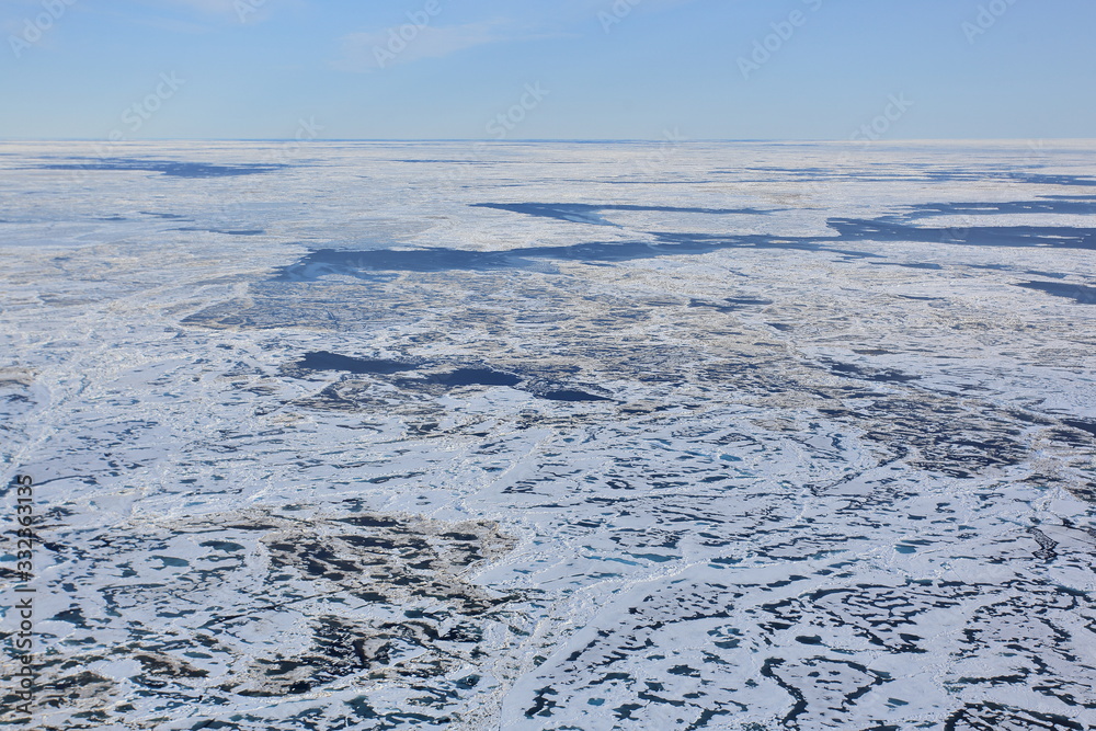 Aerial view of glacier flowing into the Arctic Ocean Aerial view of glacier flowing into the Arctic Ocean
