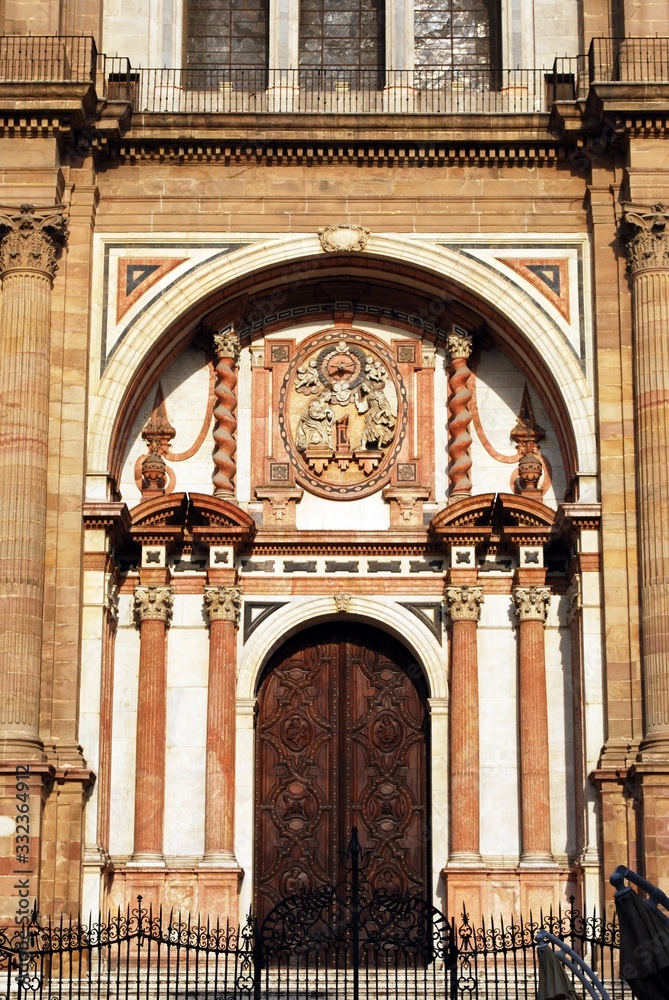 View of the Cathedrals Chain Gate door (Puerta de las Cadenas), Malaga, Spain.