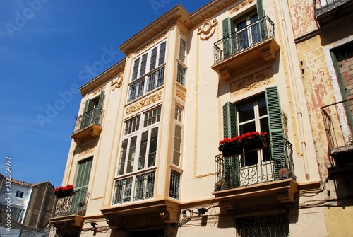 City centre townhouses with ornate balconies, Malaga, Spain.
