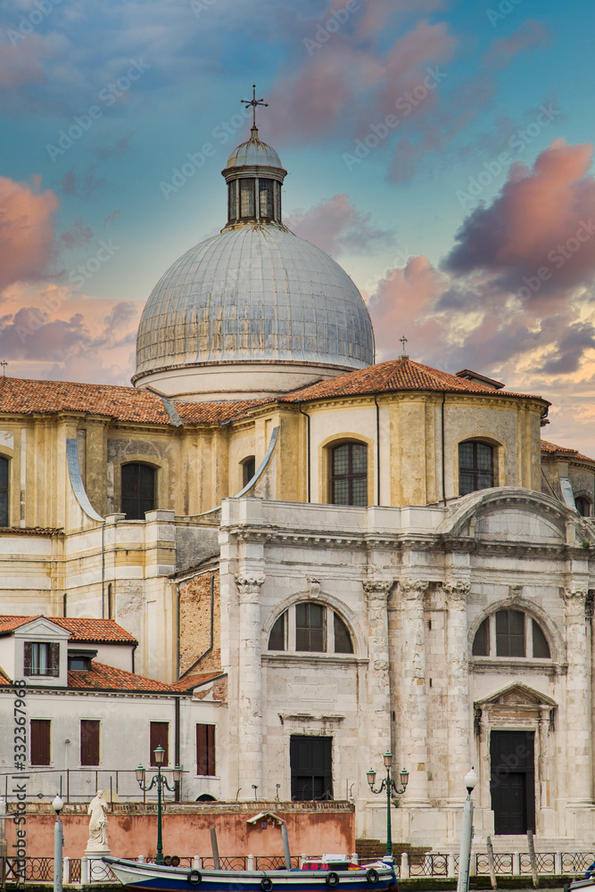 Fototapeta premium An old and weathered stone church in Venice, Italy