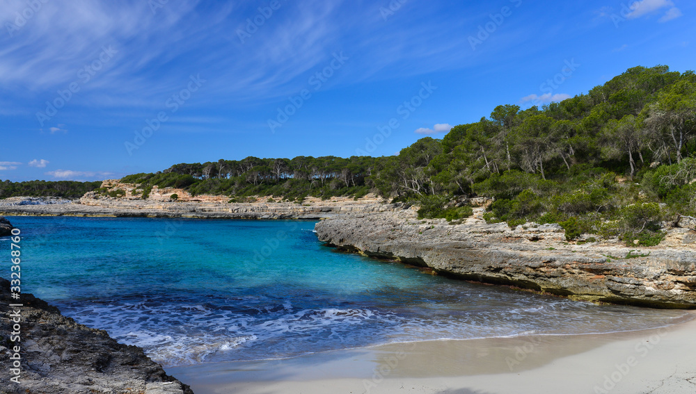 Fototapeta premium Turquoise waters of a bay in the Mondrago Natural Park, Mallorca, Spain