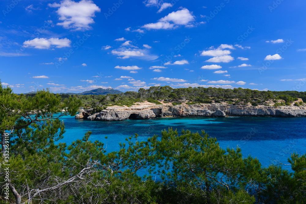 Naklejka premium Turquoise waters of a bay in the Mondrago Natural Park, Mallorca, Spain