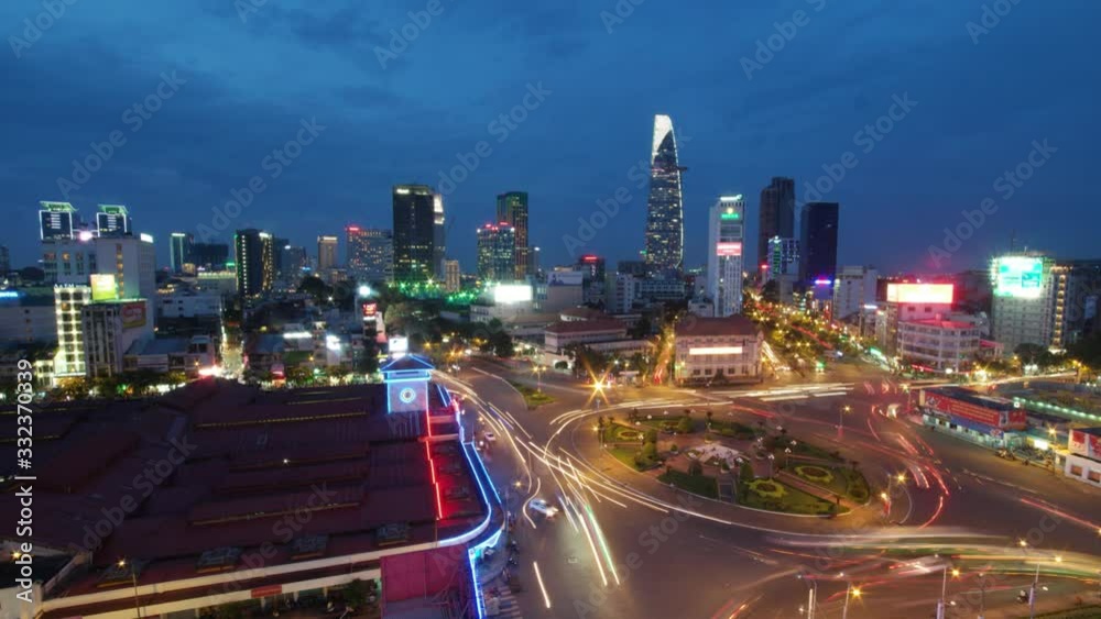 Timelapse Ben Thanh market at night, featuring Saigon skyscrapers, market is located in the center of Ho Chi Minh city, Vietnam in District 1, one of the earliest surviving structure of the city Timelapse Ben Thanh market at night, featuring Saigon skyscrapers, market is located in the center of Ho Chi Minh city, Vietnam in District 1, one of the earliest surviving structure of the city