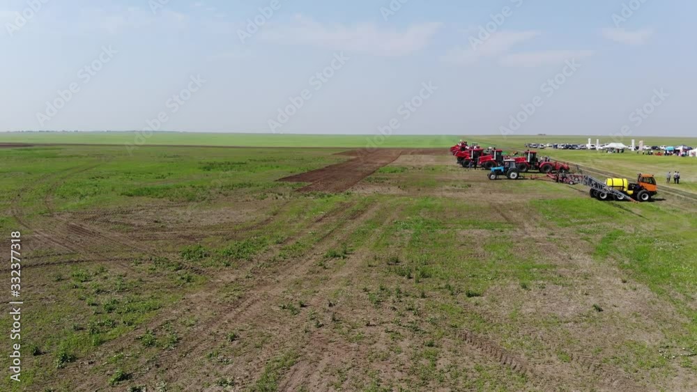 Sunny day. Morning. Agricultural machinery in the field. Sunny day. Morning. Agricultural machinery in the field.