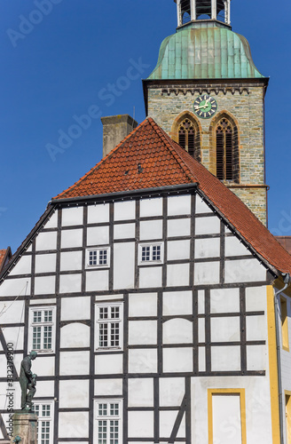 Half timbered town hall and church tower in Wiedenbruck, Germany photo