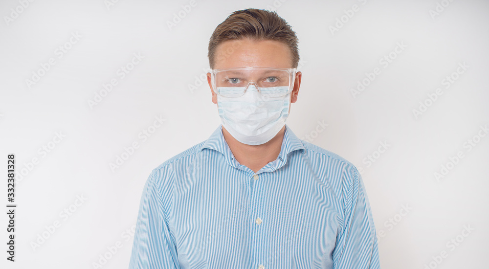 Man in a protective mask with a bottle of sanitizer. Man in a protective mask with a bottle of sanitizer.