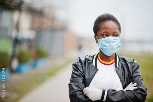 African girl at park wearing medical masks protect from infections and diseases coronavirus virus quarantine.