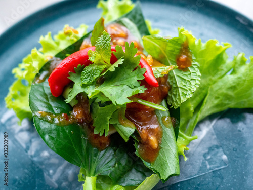 Food name is Nham Nueng is a national dish of Vietnamese people. Is a healthy food The main raw materials are Lettuce Coriander, saw blade, chili,coriander.