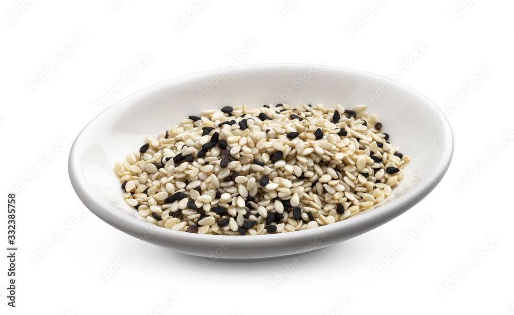 Black and white sesame seeds isolated on white background, macro Black and white sesame seeds isolated on white background, macro