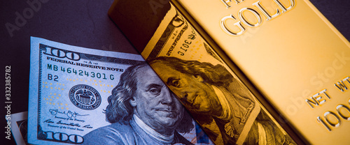 A bar of gold and a hundred-dollar bills.