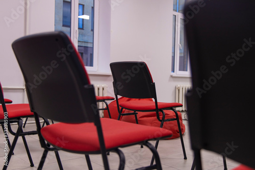 soft focus red chairs in hall interior indoor space without people © Артём Князь