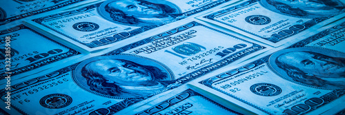 The background of a one hundred dollar bill. Style blue light.