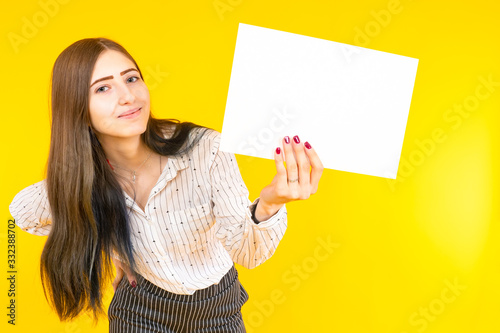Woman with white paper in h...