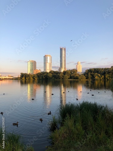 Urban landscape. Embankment of the Iset river. Ducks. Yekaterinburg