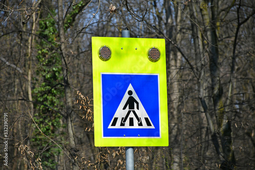 Pedestrian crossing sign on the street