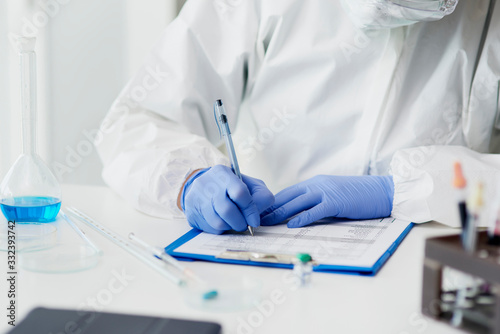 Technician making notes of medical exam