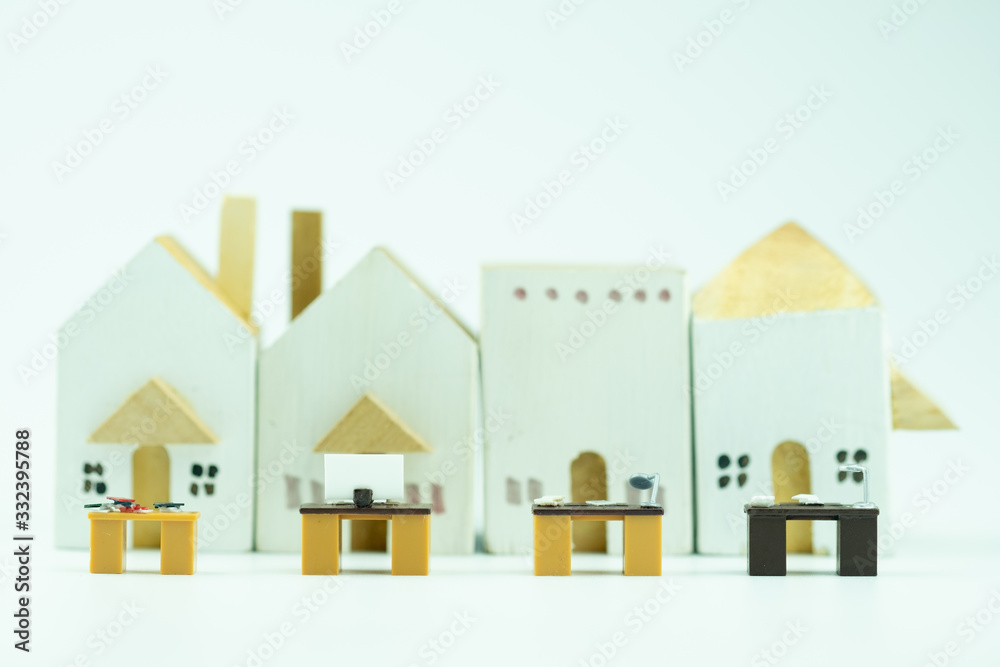 Miniature office table with wood home background Miniature office table with wood home background