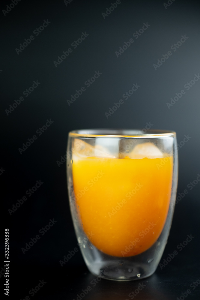 Freshly squeezed orange juice with ice cubes Freshly squeezed orange juice with ice cubes