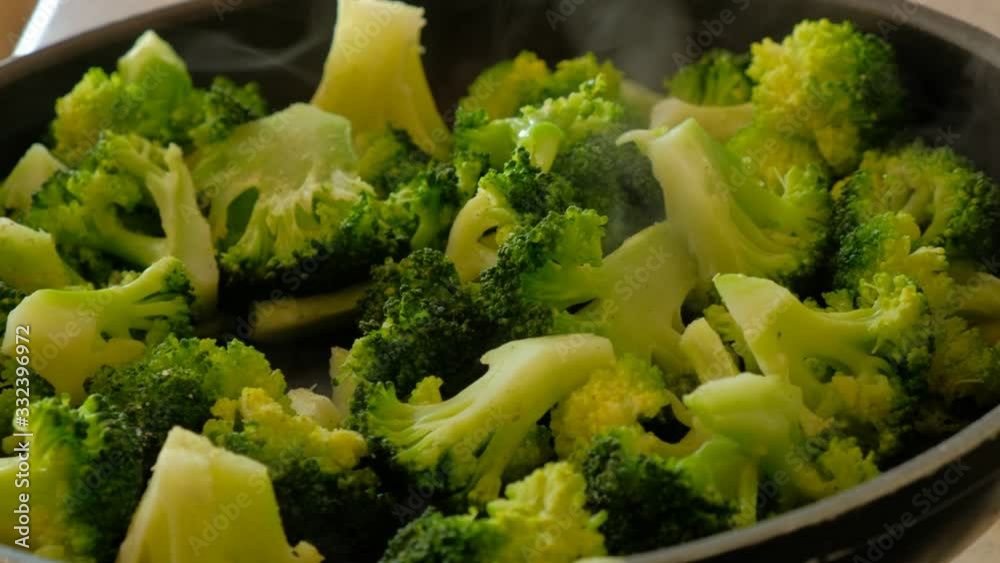 Close up of some green cooked broccoli, healty vegetarian diet Close up of some green cooked broccoli, healty vegetarian diet