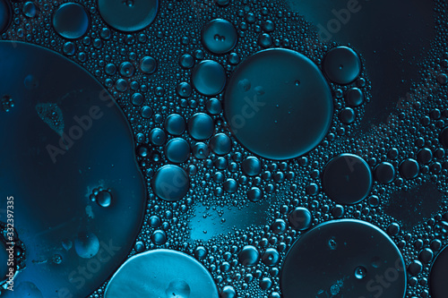 dark blue abstract background, bubbles in transparent liquid photo