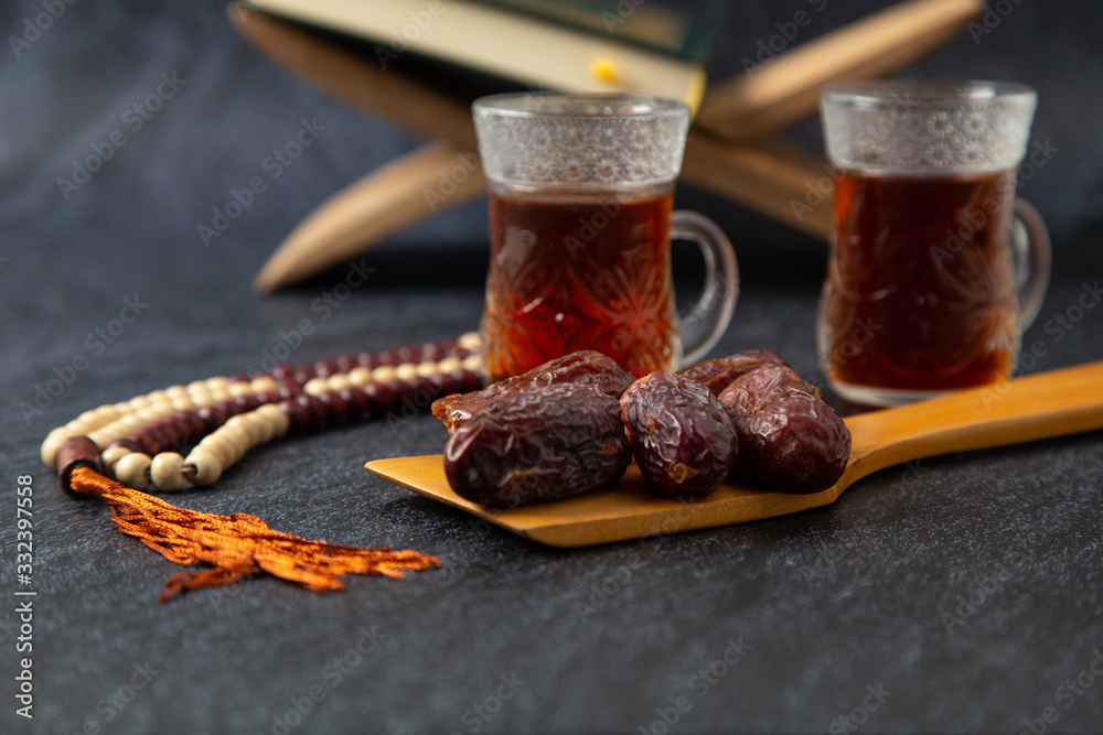 food Ramadan date Sweets mixed of dried fruits and nuts Glass Tea with a rosary and the Quran, Concept: month fasting culture Muslim and prayer for god, Ramadan food symbolic eastern Arabian food Ramadan date Sweets mixed of dried fruits and nuts Glass Tea with a rosary and the Quran, Concept: month fasting culture Muslim and prayer for god, Ramadan food symbolic eastern Arabian